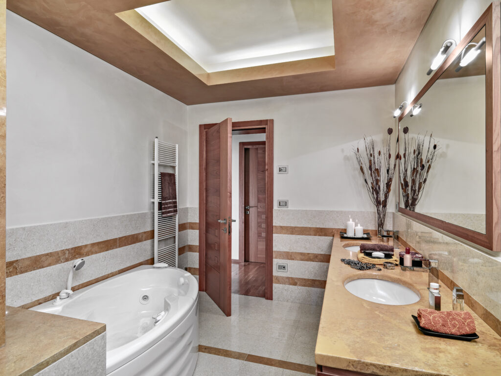 A modern bathroom with elegant details, including a bathtub and decorative elements, for a sophisticated look.